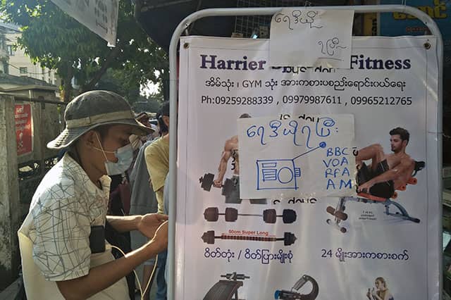 A fitness equipment shop in Yangon advertises the sale of portable radios in response to the Internet shutdown.